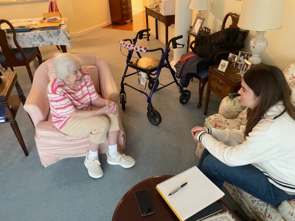 Elaine O'Malley being interviewed in her Knollwood apartment by Amaia Catan in January 2025